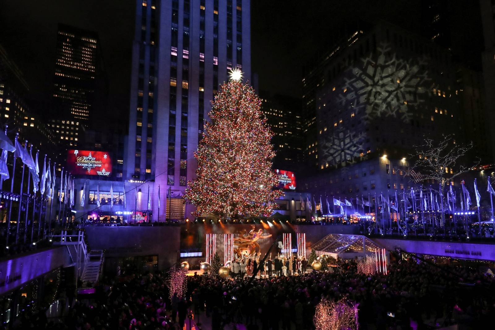 People watch the lighting of The Rockefeller Center Christmas Tree in New York City