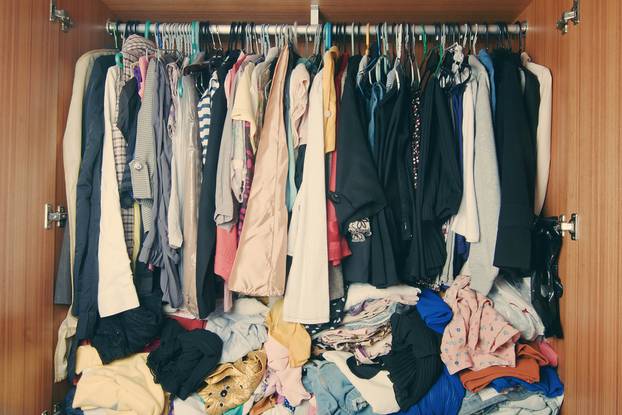 Pile,Of,Messy,Clothes,In,Closet.,Untidy,Cluttered,Woman,Wardrobe.