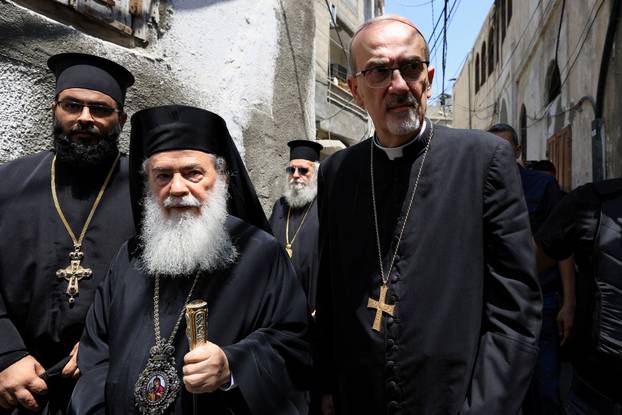 Members of the clergy visit the Greek Orthodox Saint Porphyrius Church, in Gaza City