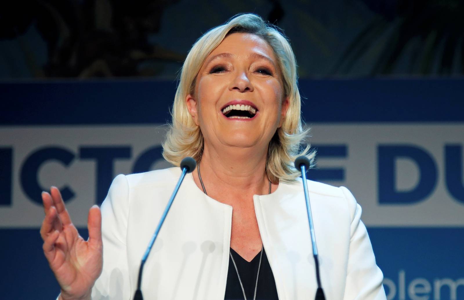 French far-right National Rally (Rassemblement National) party leader Marine Le Pen reacts after the first results in Paris