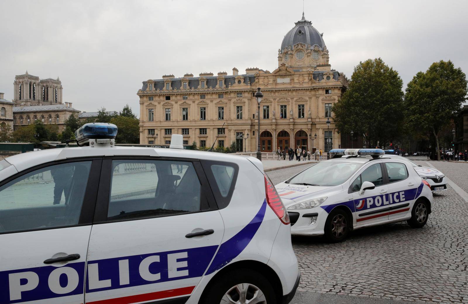 French police secure the area in front of the Paris Police headquarters in Paris