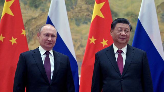 FILE PHOTO: Russian President Putin meets Chinese President Xi in Beijing