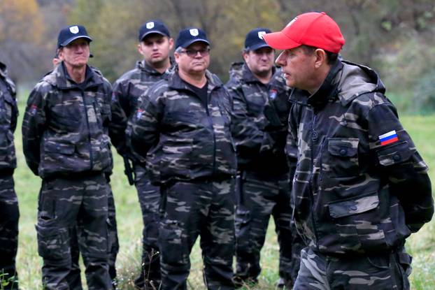 Andrej Sisko leader of Stajerska Varda (Stajerska Guard) is seen with uniformed volunteers while they hold exercises near the border with Croatia in Kostel