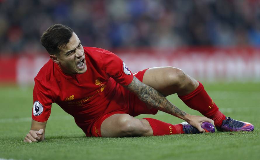 Liverpool's Philippe Coutinho reacts after sustaining an injury