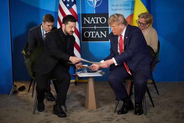 FILE PHOTO: U.S. President Trump and Ukraine's President Zelenskiy attend a meeting on the sidelines of NATO summit in The Hague