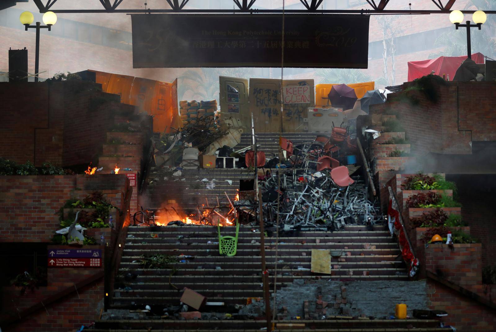 A makeshift barricade of chairs and other debris is seen on a stairway at the Hong Kong Polytechnic University (PolyU) in Hong Kong