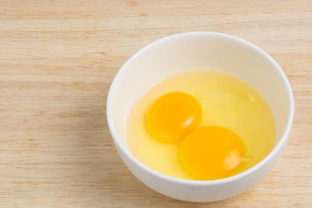 Raw eggs in a bowl, hammering