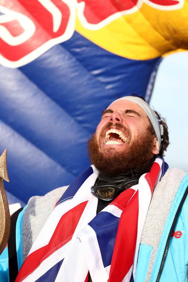 Swimmer Ross Edgley reacts after completing his round Britain swim, on Margate beach