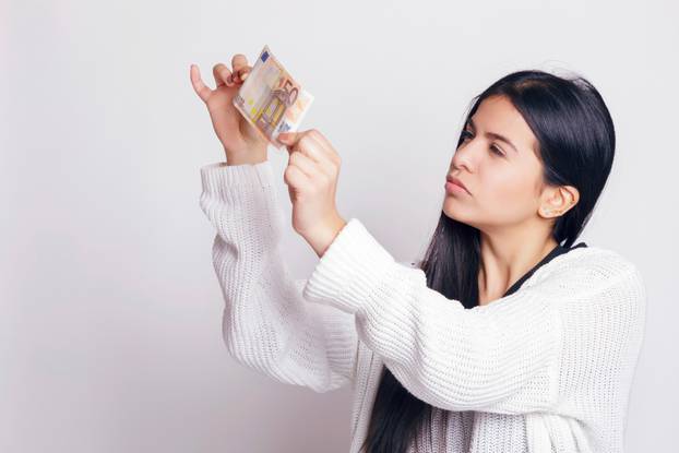 Latin,Woman,Checking,A,Fifty,Euro,Banknote.,Indoors,,Over,A