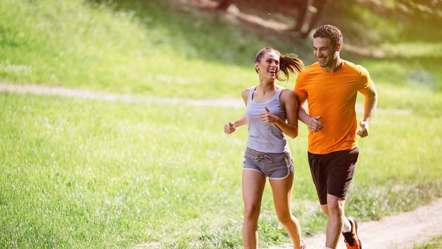 Couple,Jogging,And,Running,Outdoors,In,Nature