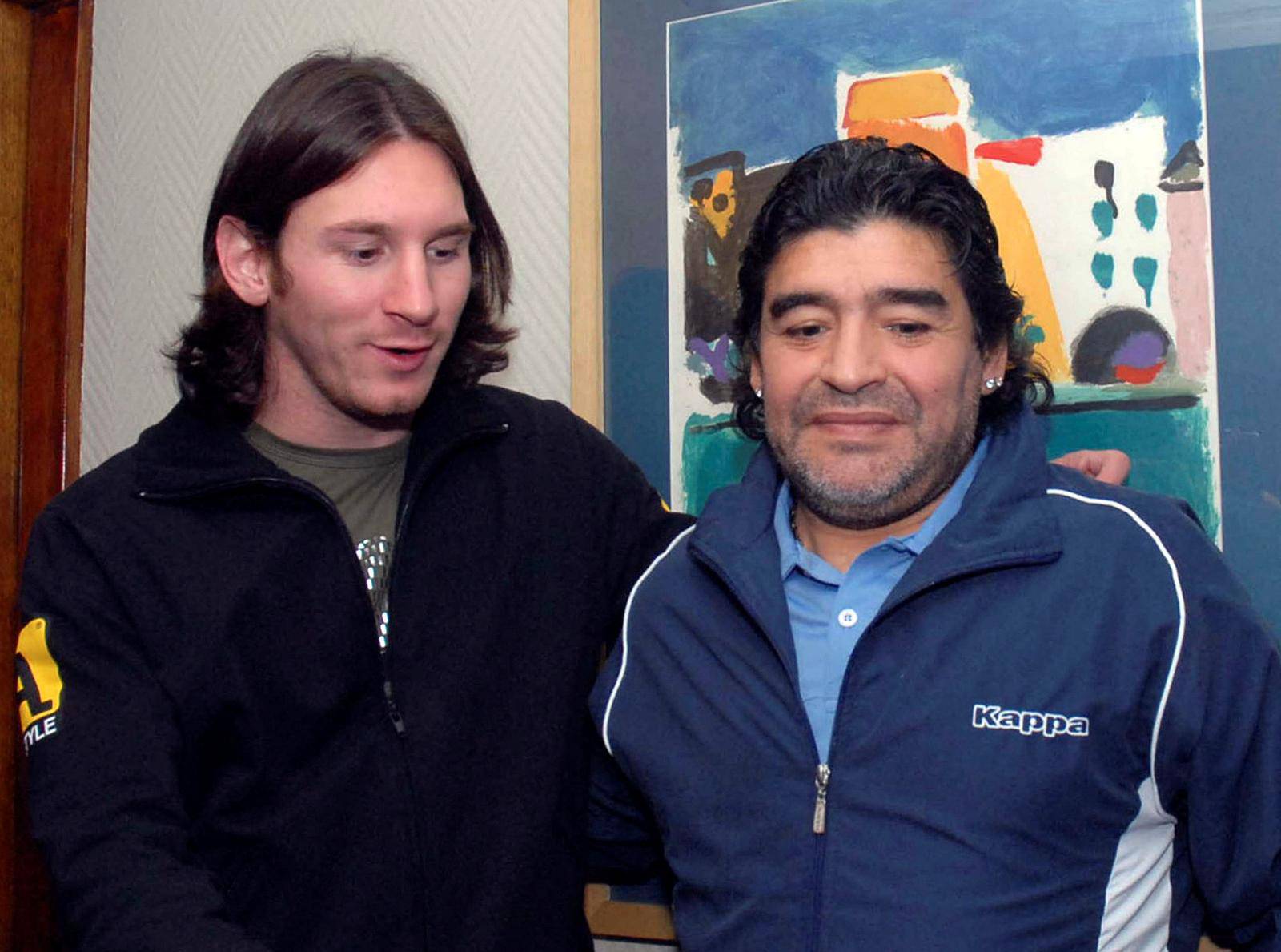FILE PHOTO: Argentine soccer player Messi meets former soccer star Maradona in Rosario