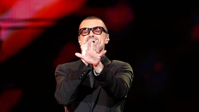 FILE PHOTO British singer George Michael performs on stage during his "Symphonica" tour concert in Berlin