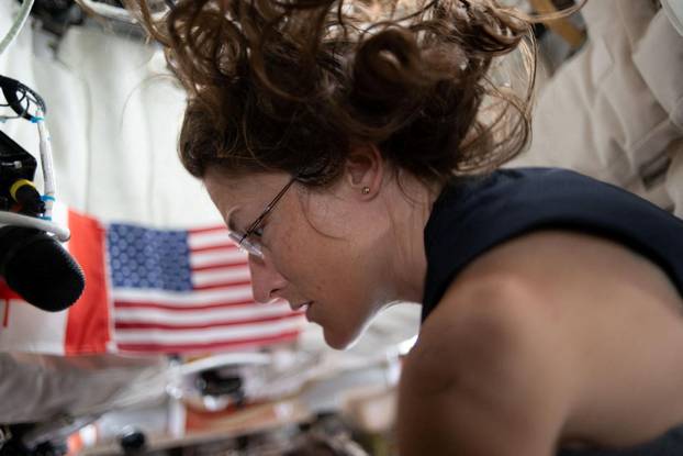 NASA astronaut and Artemis II mission specialist Christina Koch prepares for the upcoming lunar flyby inside the Orion spacecraft