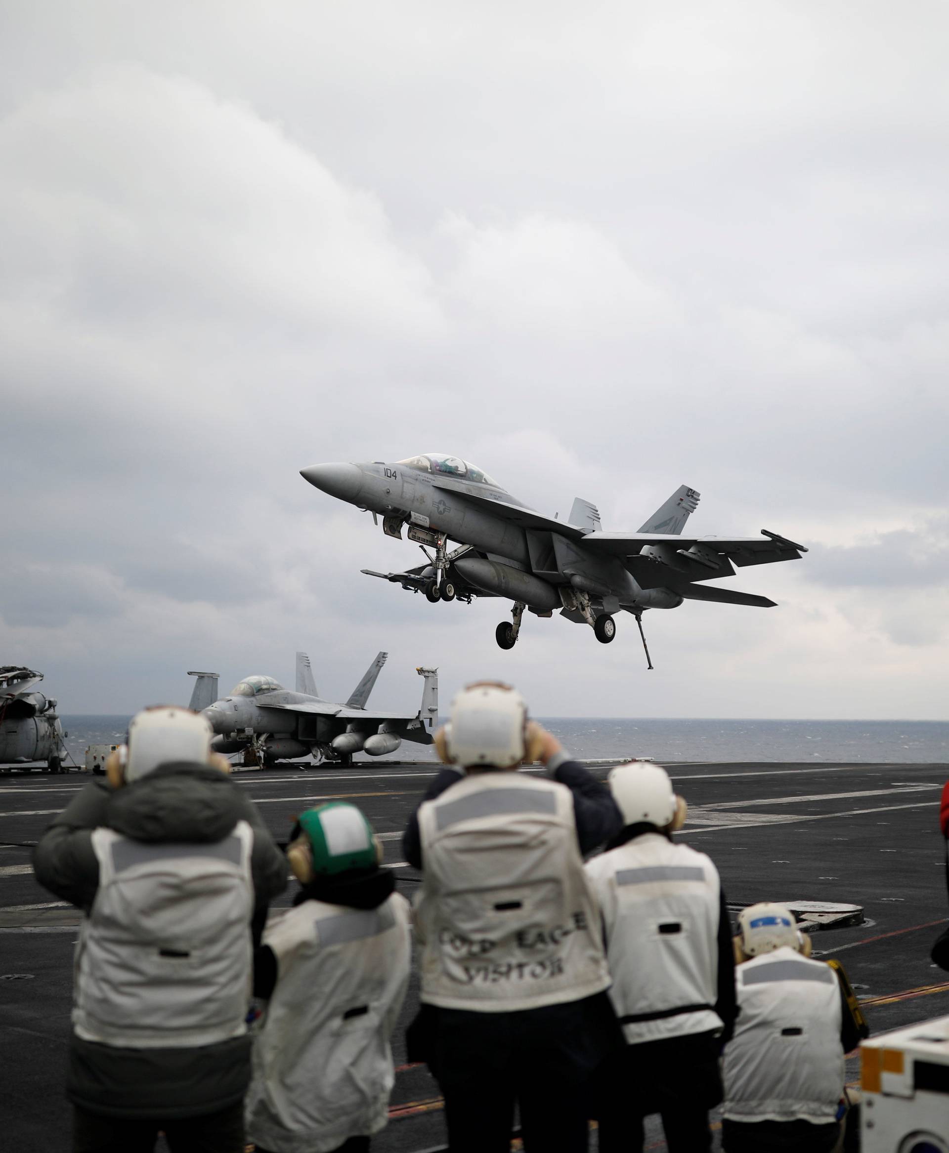 A U.S. F18 fighter jet lands on the deck of U.S. aircraft carrier USS Carl Vinson during an annual joint military exercise called "Foal Eagle" between South Korea and U.S., in the East Sea