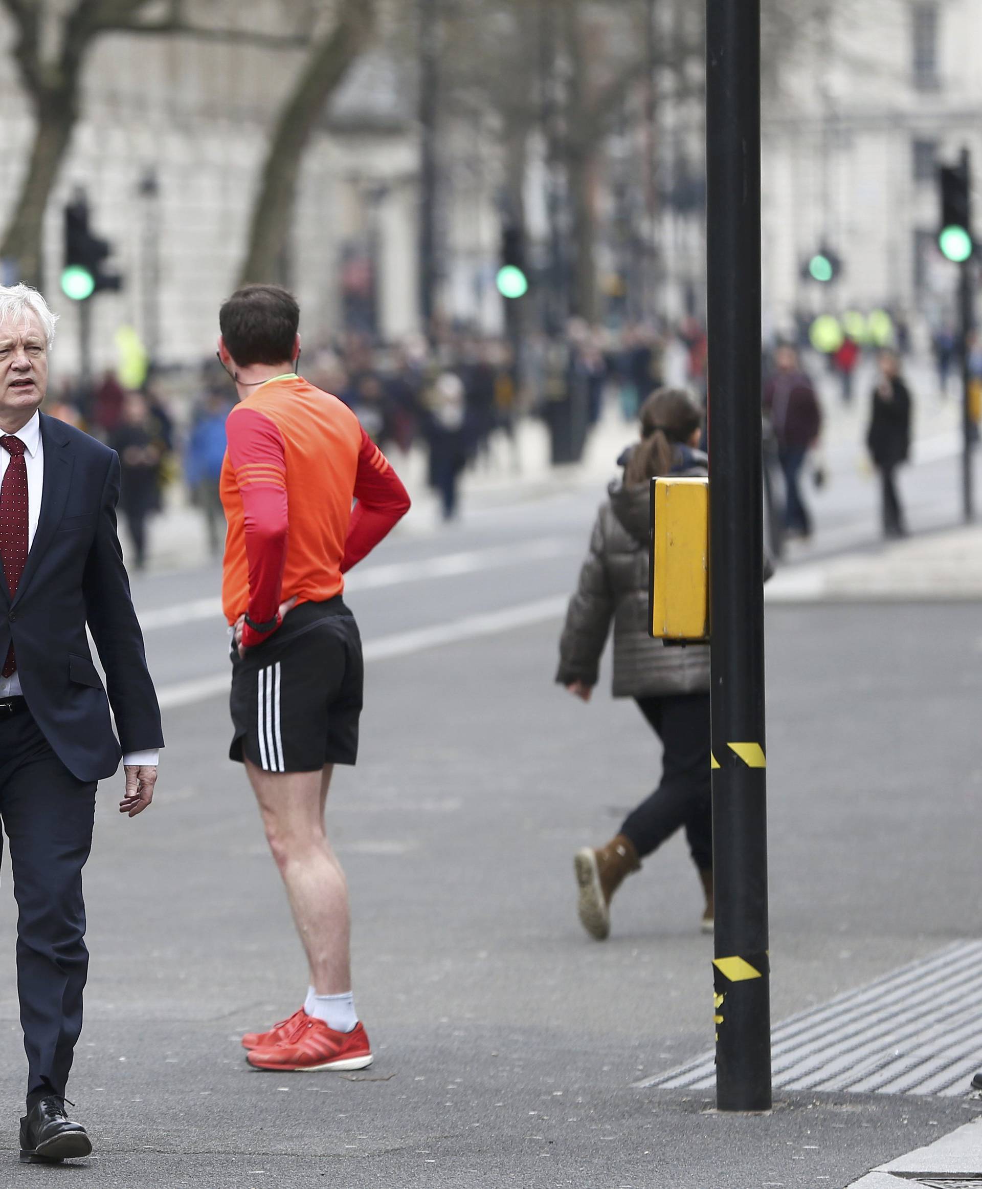 Britain's Secretary of State for leaving the EU David Davis walks down Whitehall the morning after an attack in London