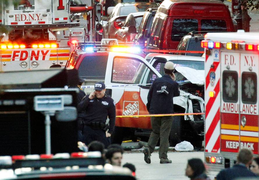 Investigators are near the Home Depot truck which struck down multiple people on a bike path, killing several and injuring numerous others at the crime scene in lower Manhattan in New York