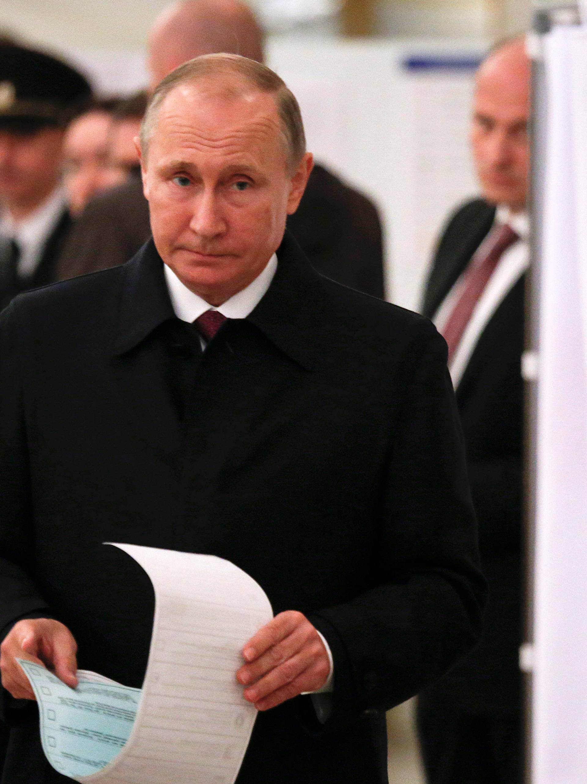 Russian President Putin visits polling station during parliamentary election in Moscow