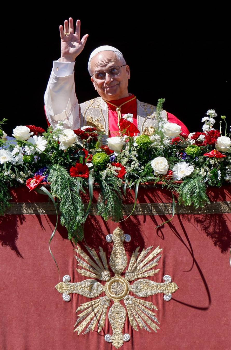 Pope Leo XIV delivers his "Urbi et Orbi" (To the city and the world) message from the main balcony of St. Peter's Basilica