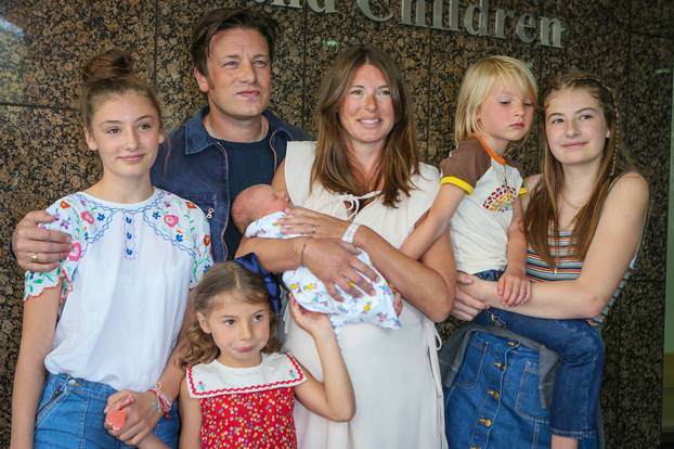 Jamie Oliver and his wife Jules leaving the Portland Hospital with their 5th baby boy who was born yesterday - London