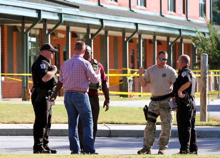 Anderson County sheriff's deputies and investigators gather outside of Townville Elementary School after a shooting in Townville