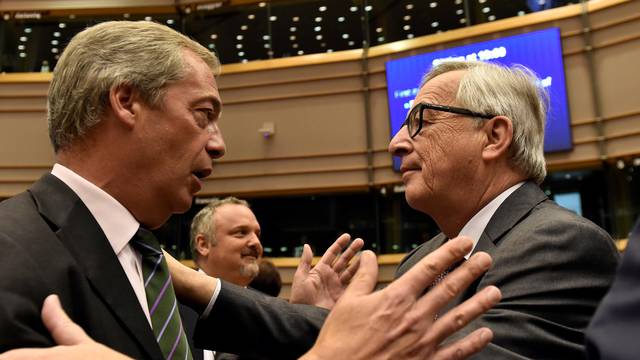 EC President Juncker welcomes Farage, the leader of the UKIP, prior to a plenary session at the European Parliament on the outcome of the "Brexit" in Brussels