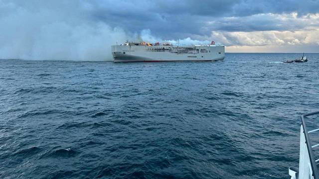 FILE PHOTO: Smoke rises as a fire broke out on the cargo ship Fremantle Highway, at sea