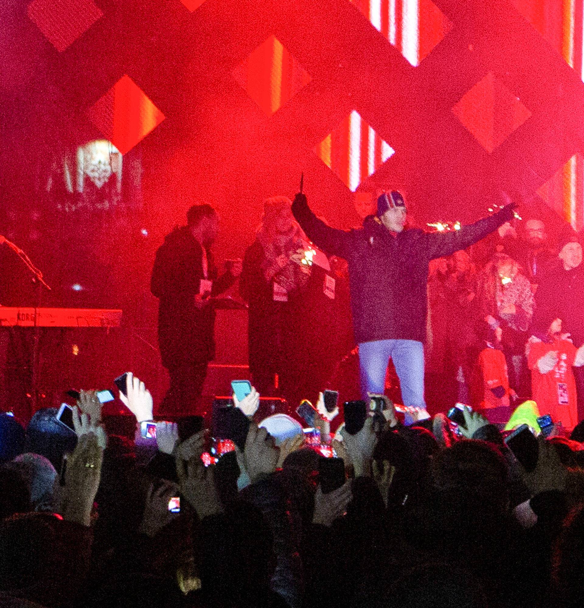 A man holding a knife shouts on the stage just after Gdansk's Mayor Pawel Adamowicz was stabbed during an open-air 27th Grand Finale of the Great Orchestra of Christmas Charity in Gdansk