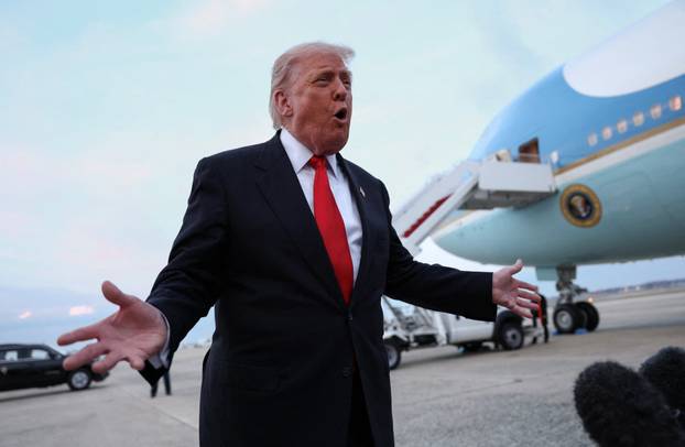 Trump speaks to reporters upon his return to Washington