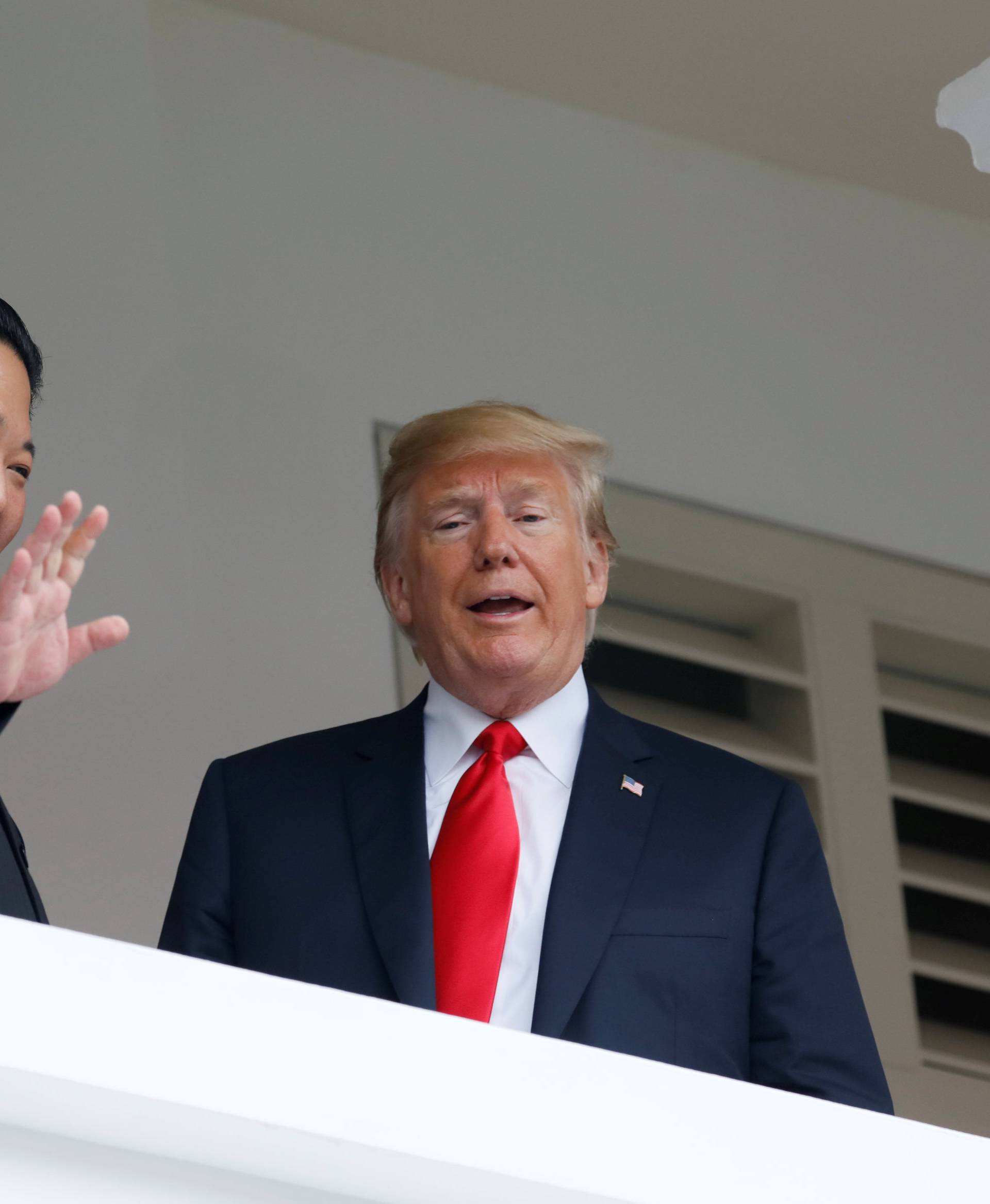 U.S. President Donald Trump talks with North Korean leader Kim Jong Un at the Capella Hotel on Sentosa island in Singapore