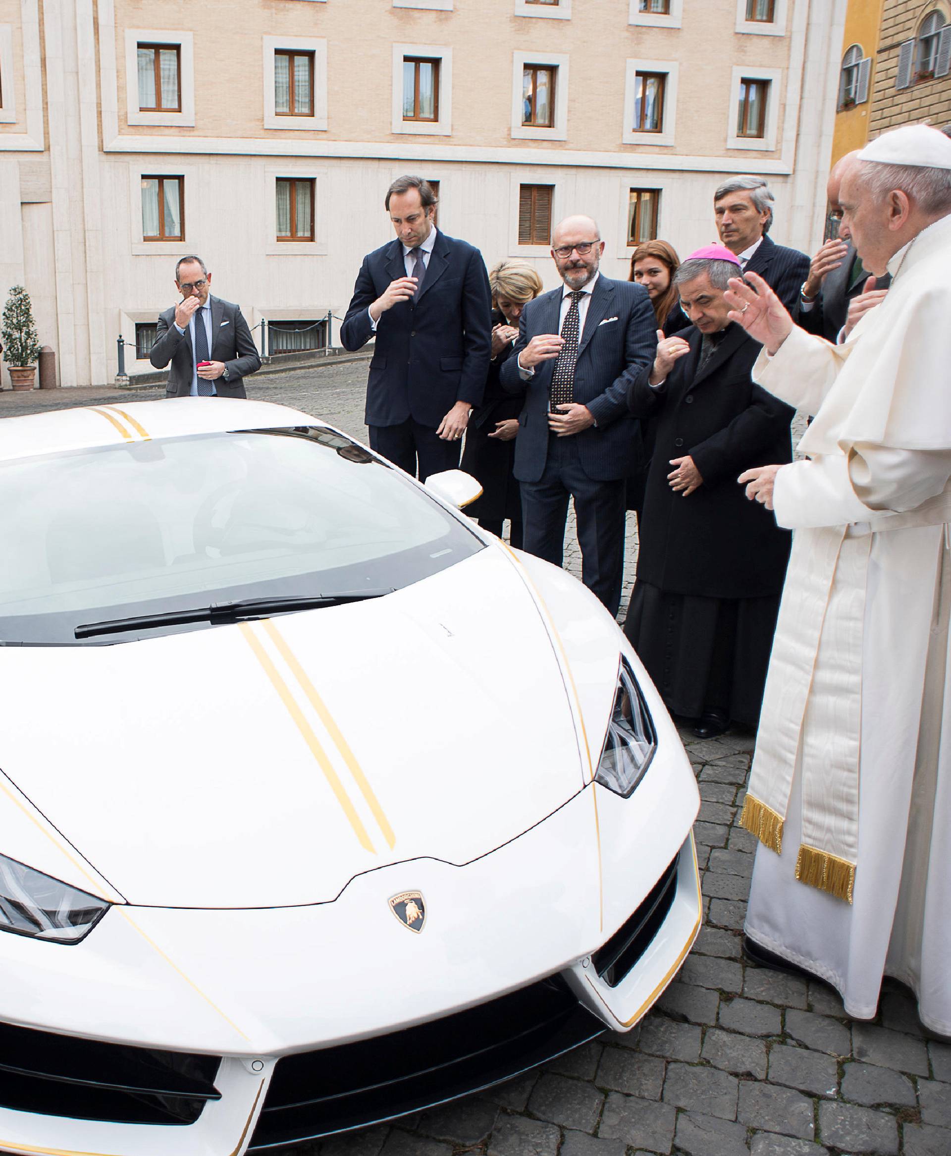 Pope Francis blesses a Lamborghini Huracan prior to his Wednesday general audience in Saint Peter's square at the Vatican