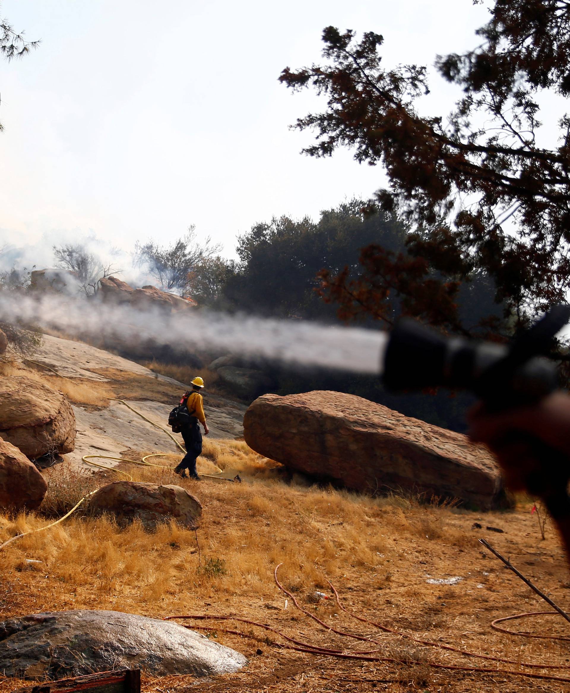 Firefighters battle the Peak fire in Simi Valley