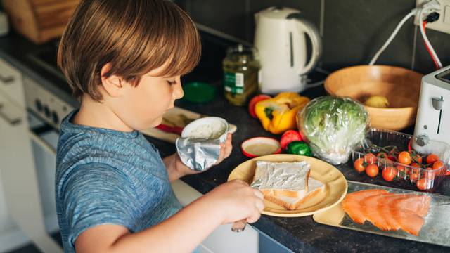 Cute,Little,Boy,Making,Salmon,Sandwich,With,Fresh,Ingredients,,Spreading