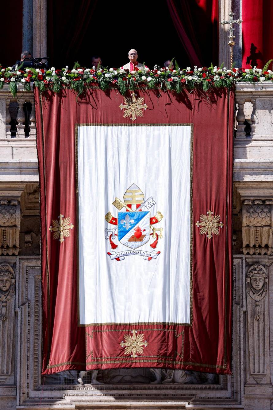 Pope Leo XIV delivers his "Urbi et Orbi" (To the city and the world) message from the main balcony of St. Peter's Basilica