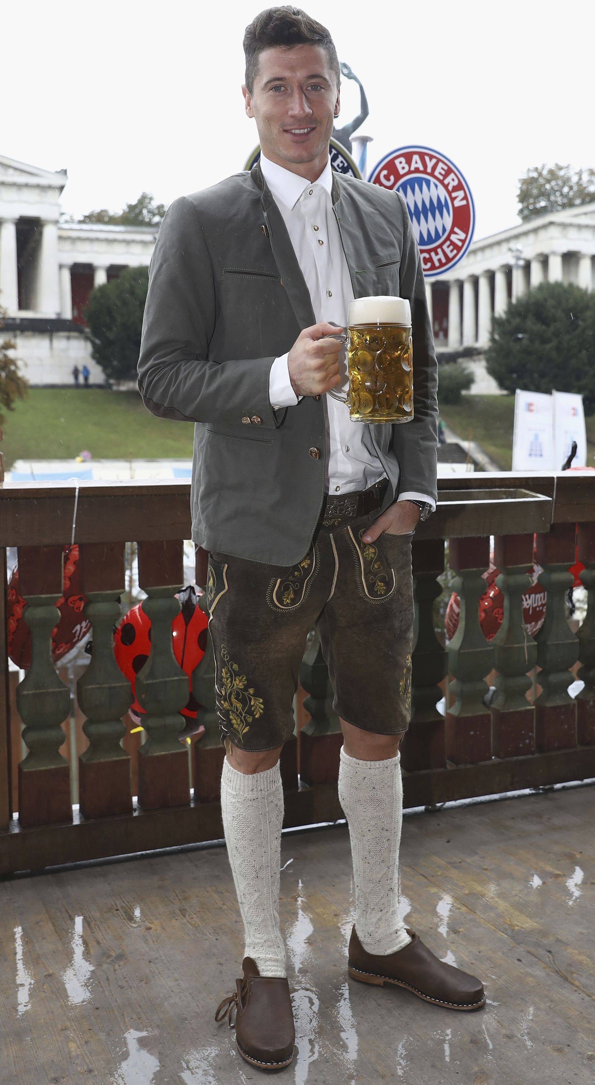 Lewandowski of FC Bayern Munich poses during their visit at the Oktoberfest in Munich