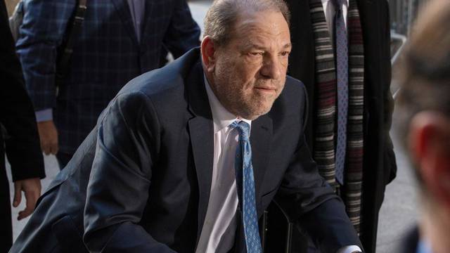 FILE PHOTO: Harvey Weinstein arrives at New York Criminal Court for another day of jury deliberations in his sexual assault trial in the Manhattan borough of New York City