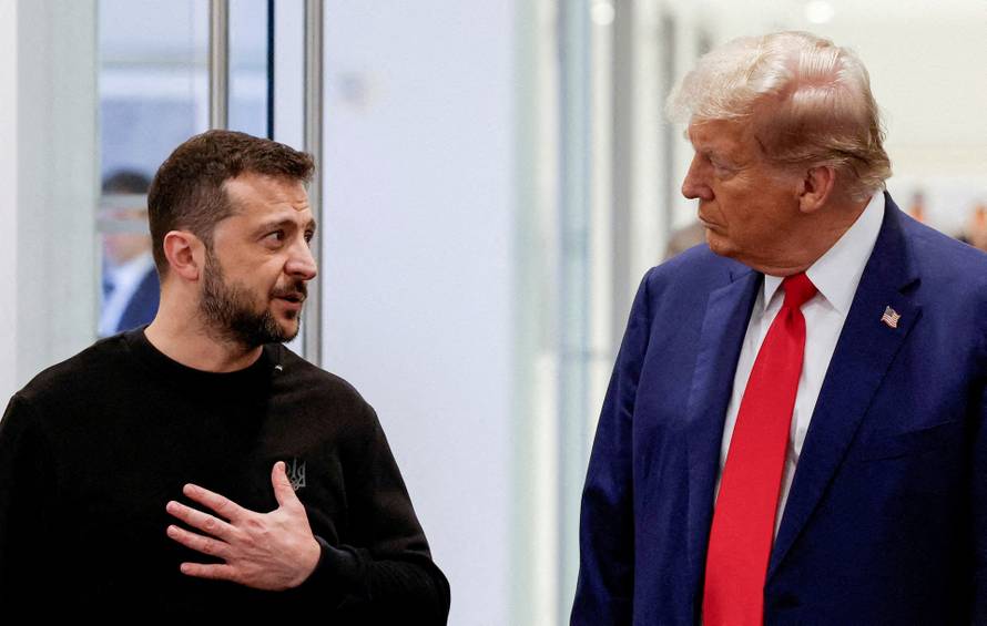 FILE PHOTO: Republican presidential nominee and former U.S. President Donald Trump and Ukraine's President Volodymyr Zelenskiy meet in New York