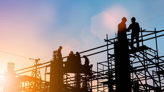 Silhouette,Of,Engineer,And,Construction,Team,Working,At,Site,Over
