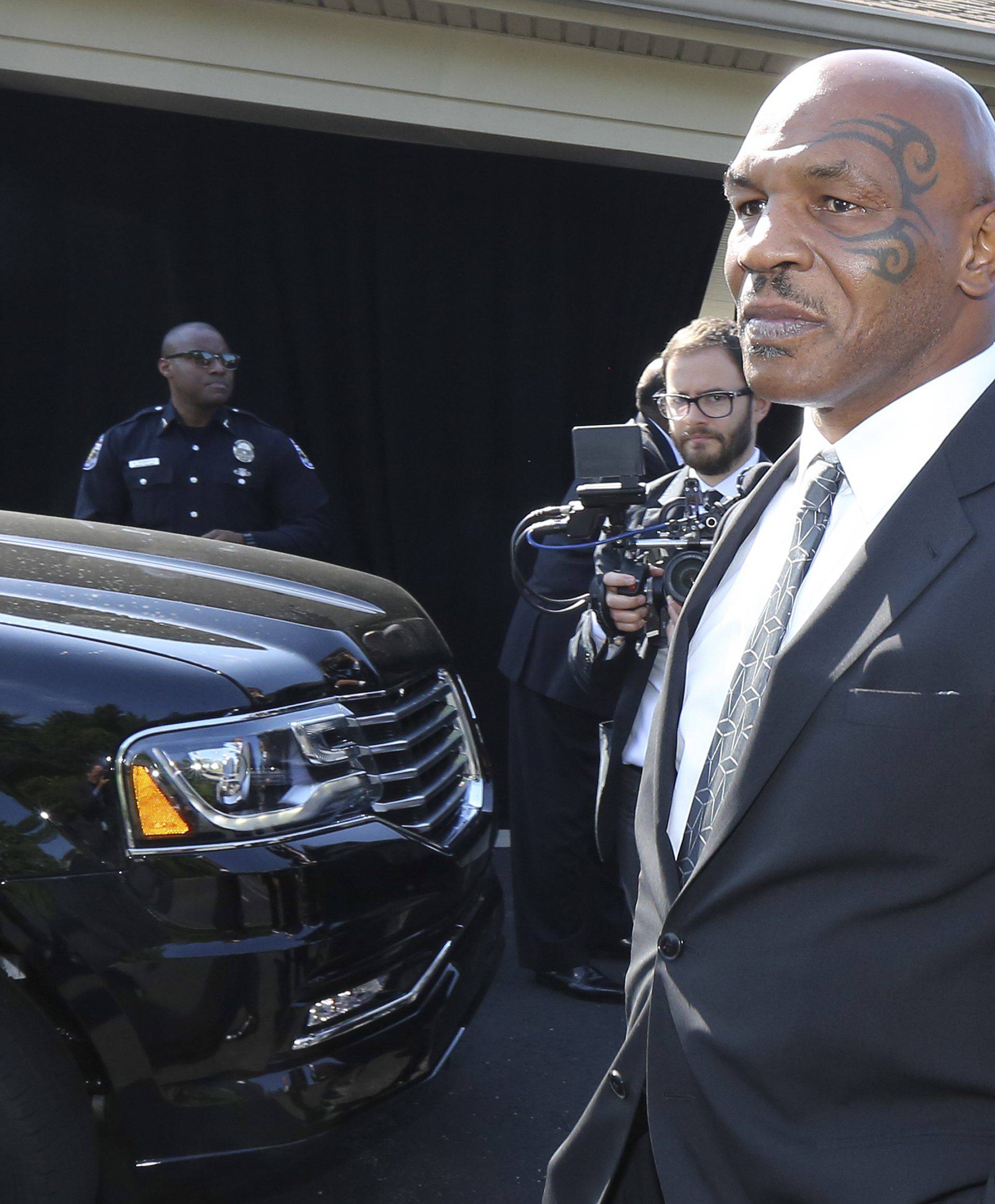 Pallbearer Mike Tyson leaves the funeral home to attend Muhammad Ali's memorial in Louisville