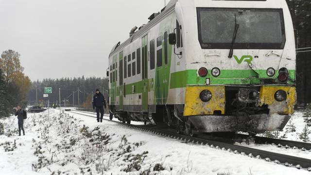 Passenger train near the railroad crossing is pictured after a crash in Raasepori