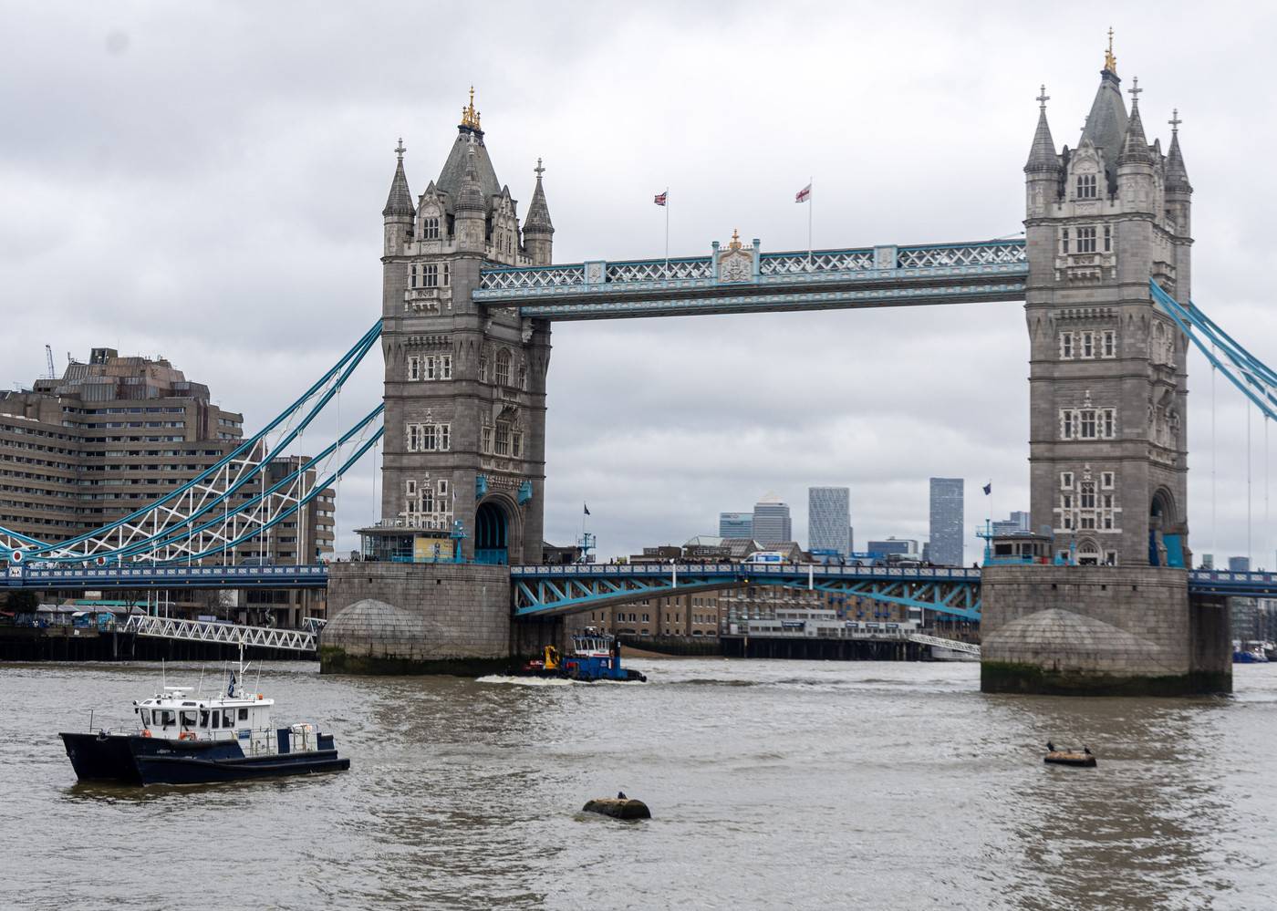 Police recover a body in the River Thames in London, UK.