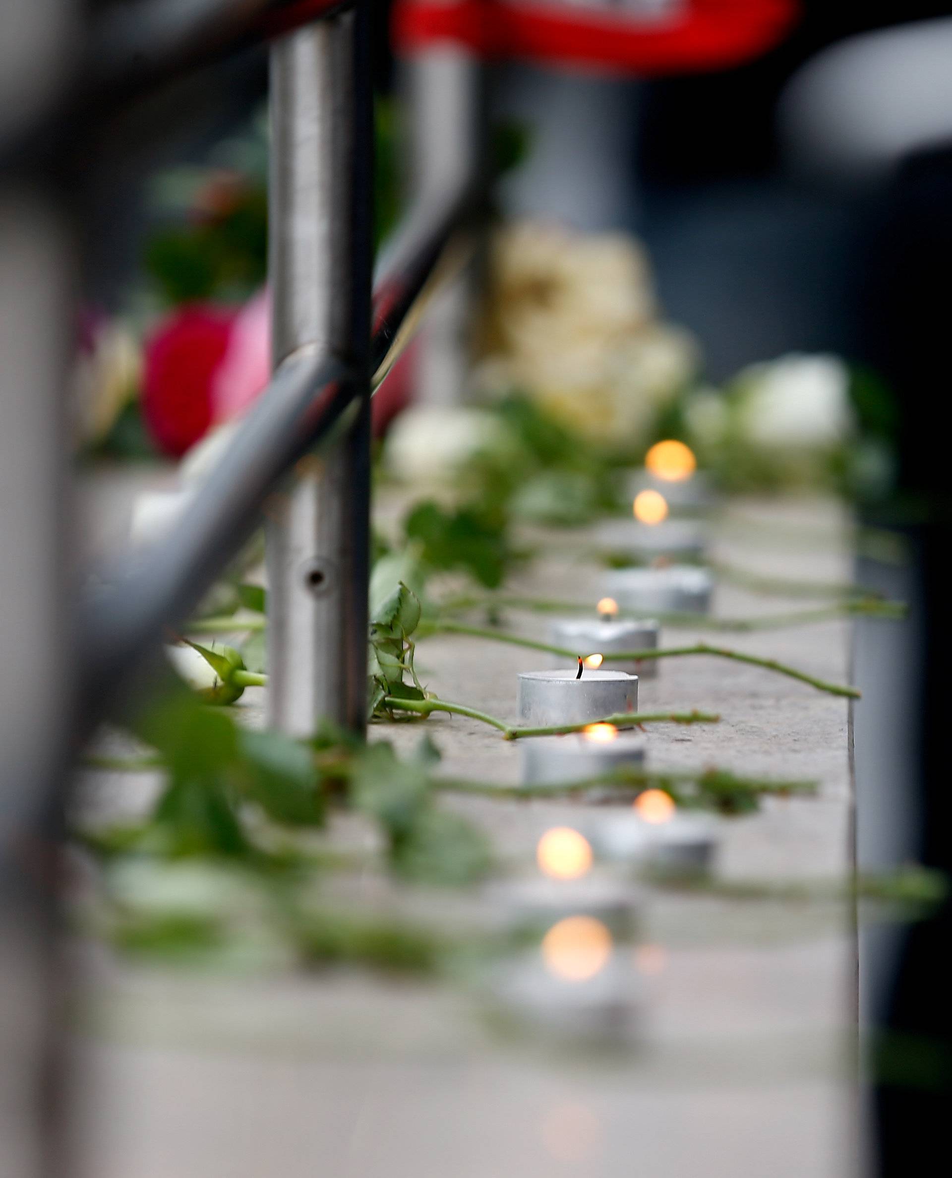 Candles are lit near the Olympia shopping mall, where yesterday's shooting rampage started in Munich
