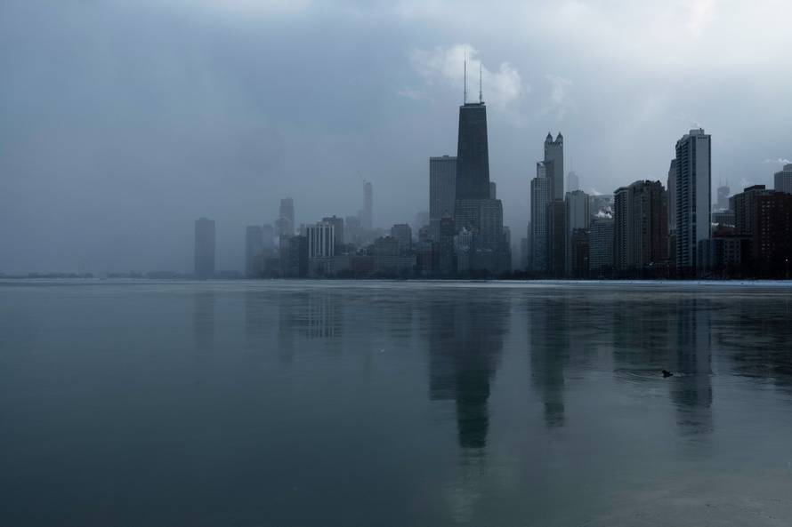 The fog begins to cover the city skyline as bitter cold phenomenon called the polar vortex has descended on much of the central and eastern United States