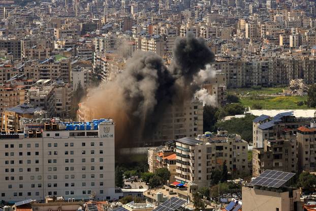 Smoke rises following an Israeli strike on the southern suburbs of Beirut