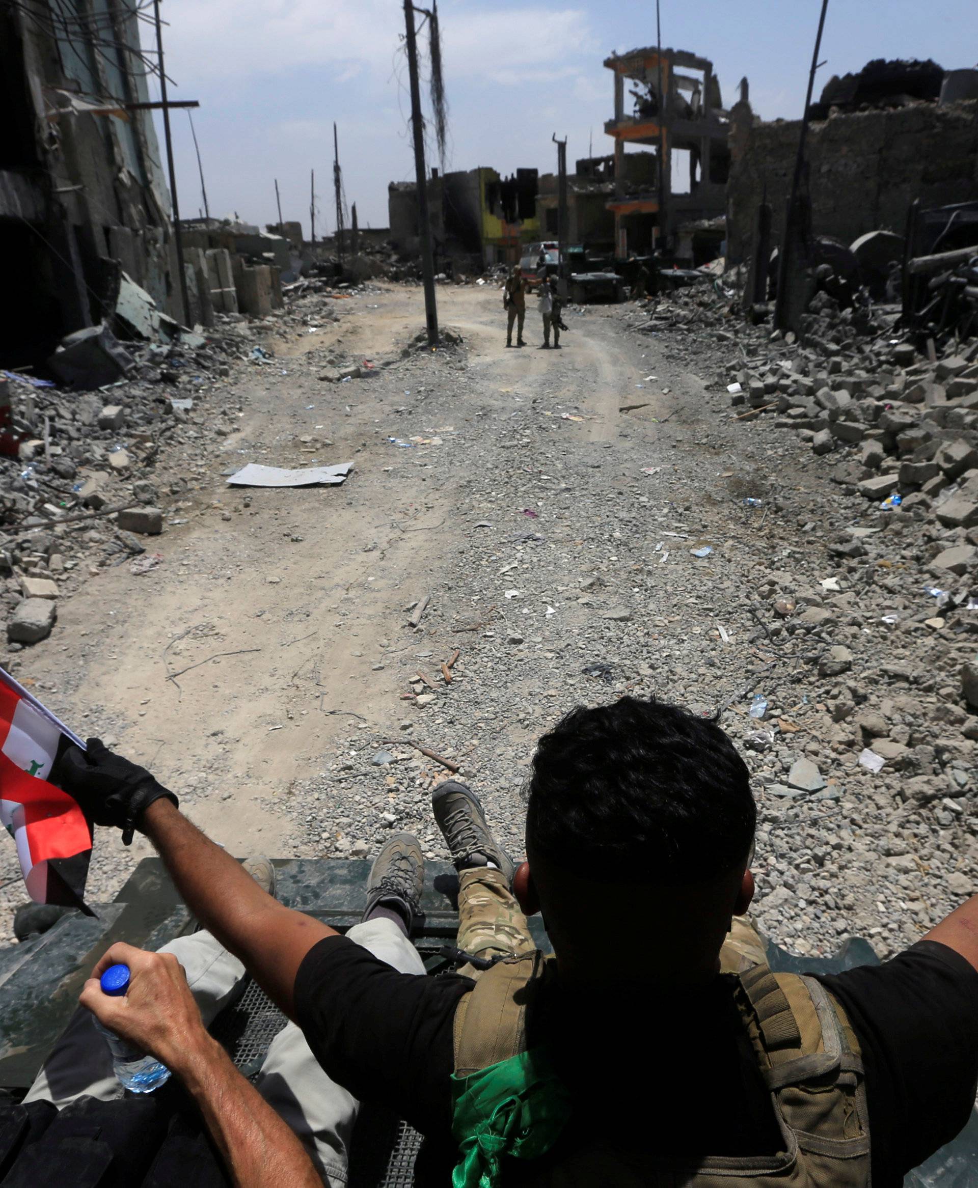 Members of the Emergency Response Division celebrate in the Old City of Mosul