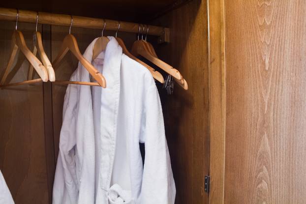 White Hotel gown on a hanger in the wardrobe