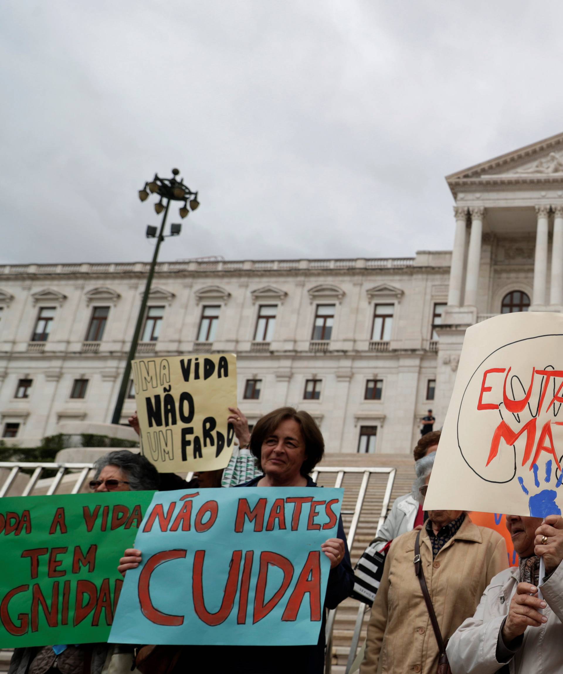 Demonstrators attend a protest against euthanasia in front off the parliament in Lisbon