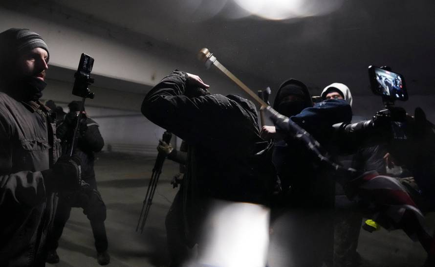 People attend the "March Against Minnesota Fraud" in Minneapolis