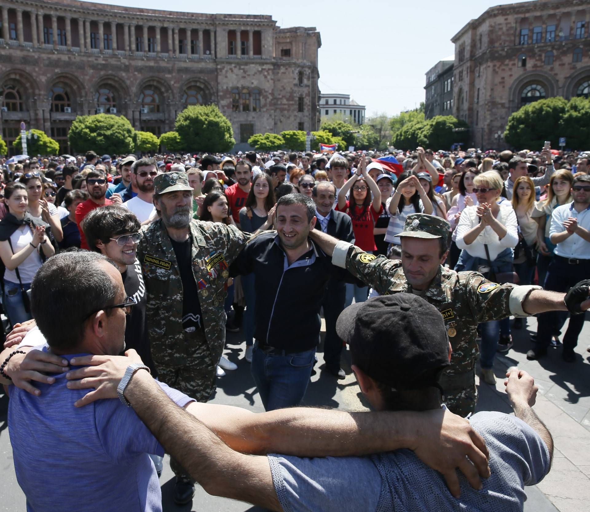 Armenian opposition supporters dance on the street after protest movement leader Nikol Pashinyan announced a nationwide campaign of civil disobedience in Yerevan