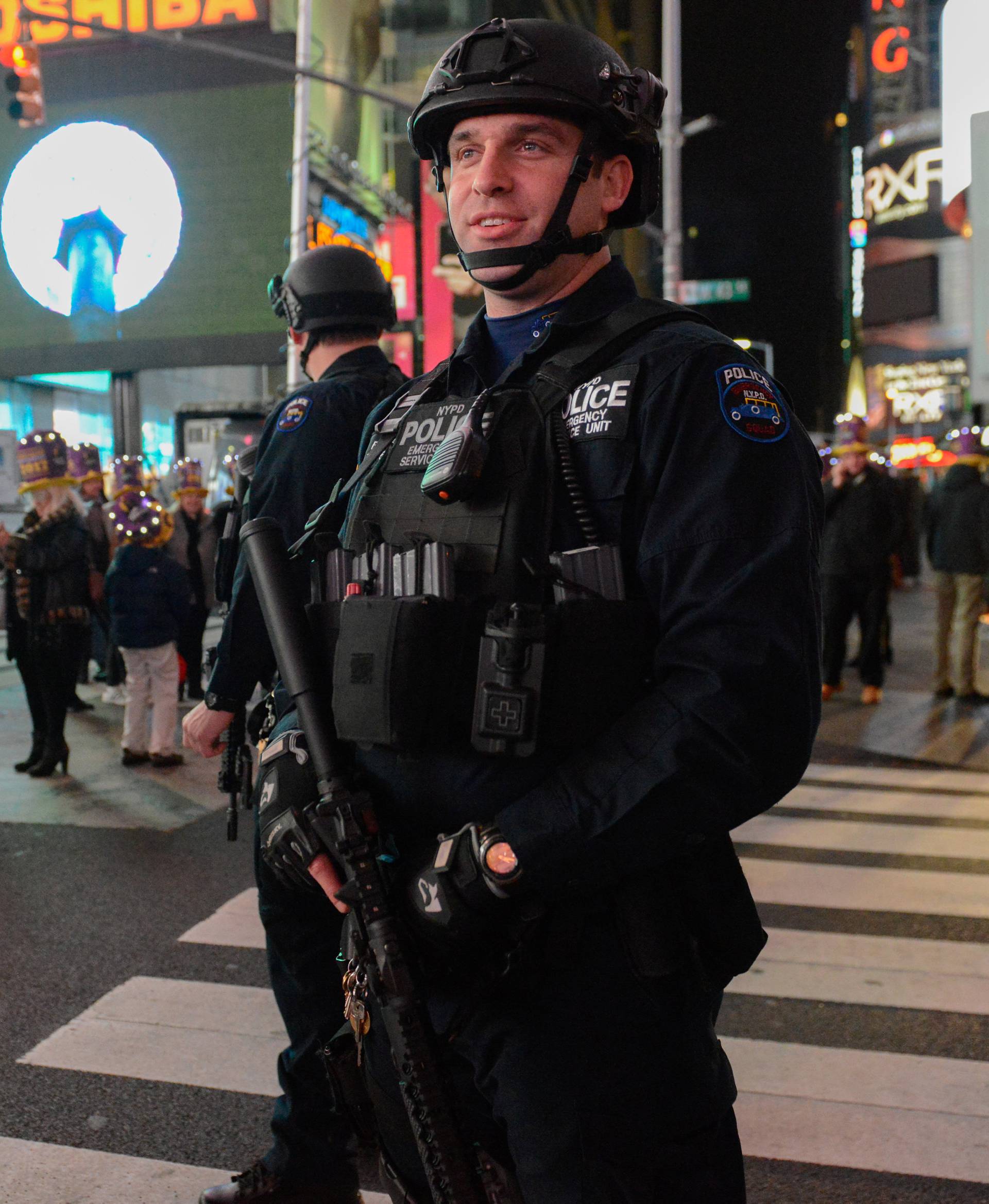Members of the counter terrorism task force stand guard in Times Square on New Year's Eve in New York