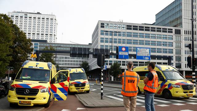 Police officers secure the area after Dutch police arrested a suspect after a shooting in Rotterdam